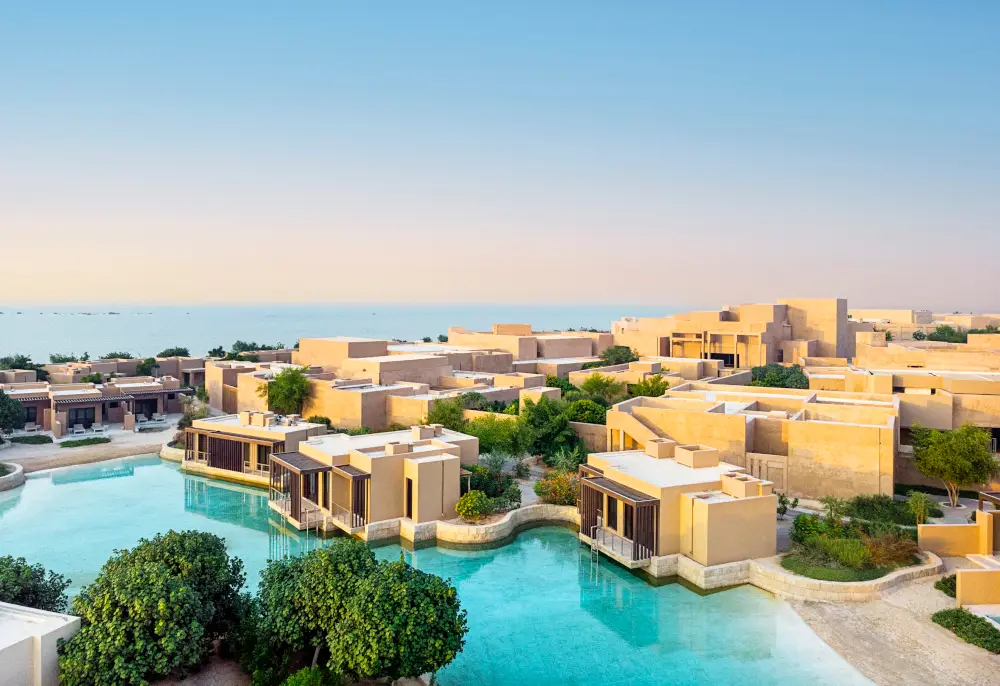 Luxurious spa resort with premium treatment tables by a serene waterfront.