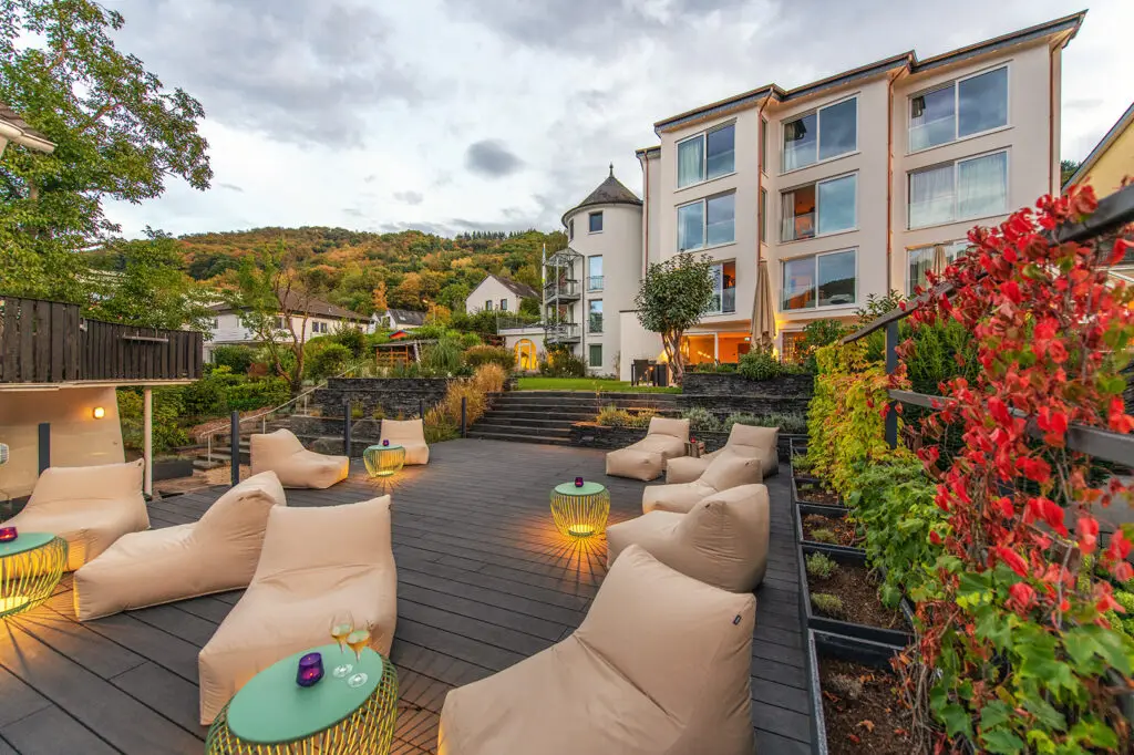Luxurious outdoor spa lounge with modern seating and ambient lighting.