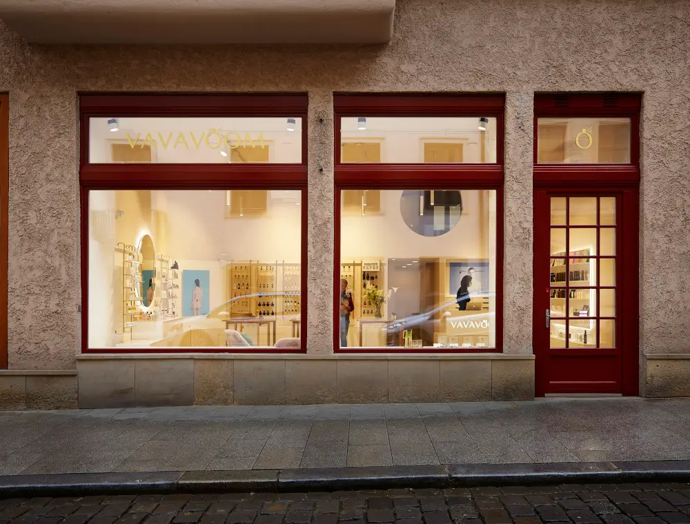 Storefront with elegant spa interiors, showcasing luxury treatment tables and equipment.