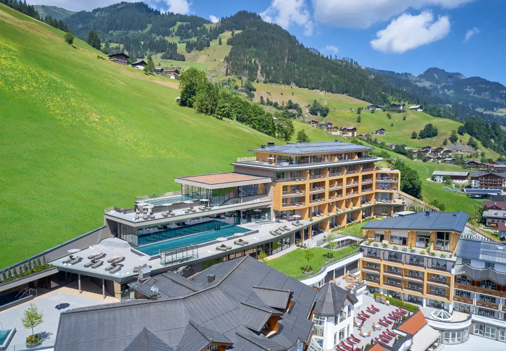 Luxurious mountain resort with spa and pool, showcasing premium Gharieni equipment.