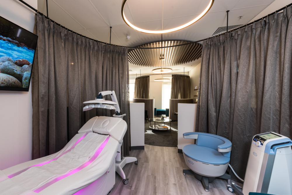 Luxurious spa room with Gharieni treatment table and advanced equipment.