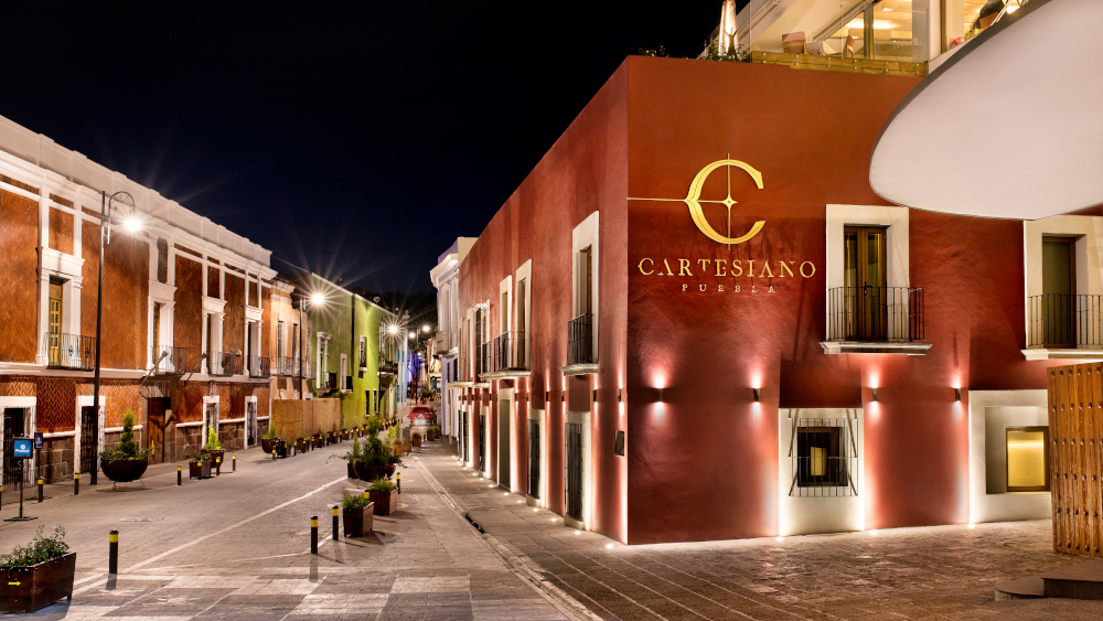 I'm unable to view images but based on your description, here's a sample alt-text:

"Elegant urban street scene at night with illuminated historic architecture."