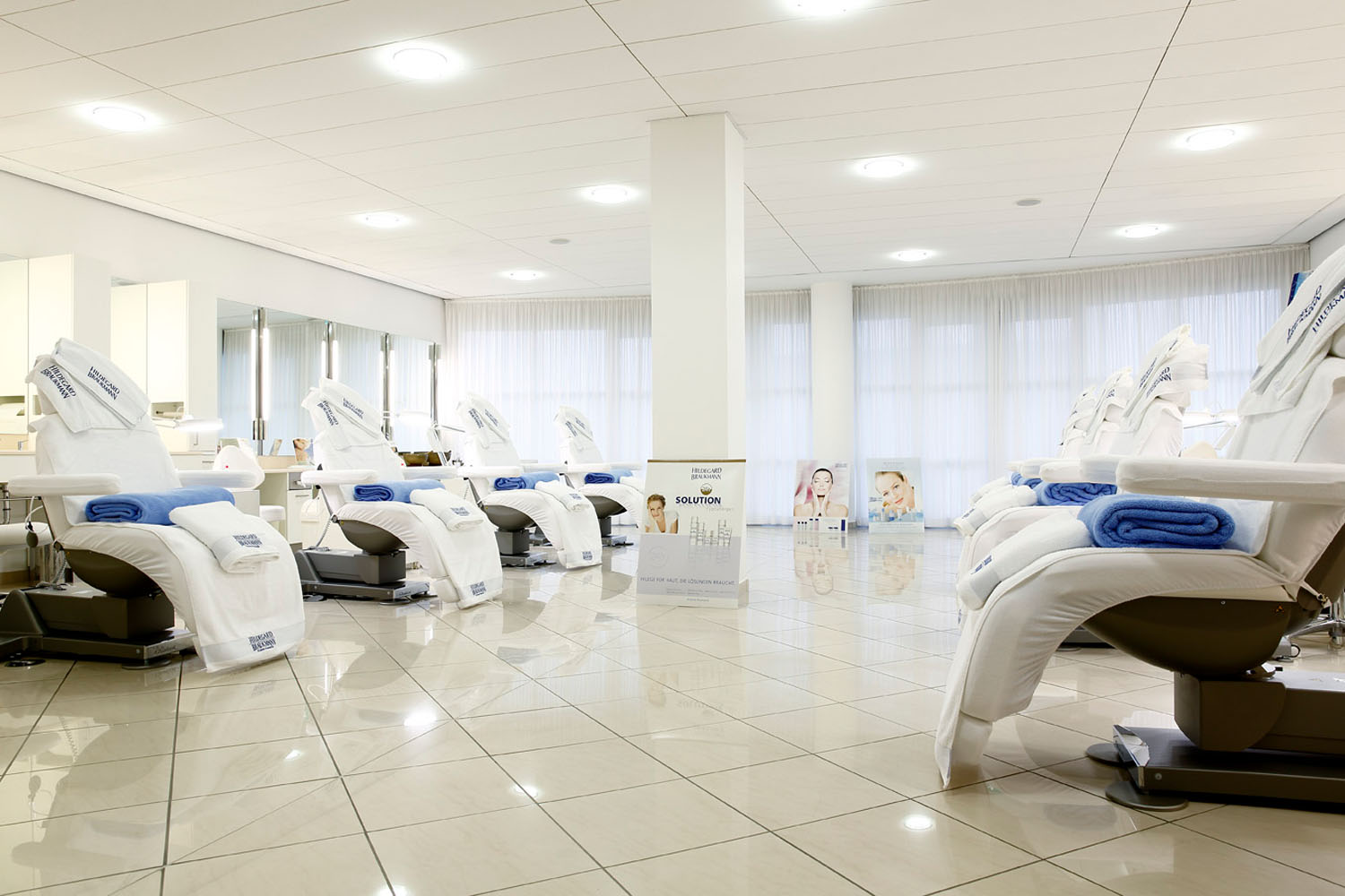 Luxurious Gharieni spa treatment tables in modern wellness center.