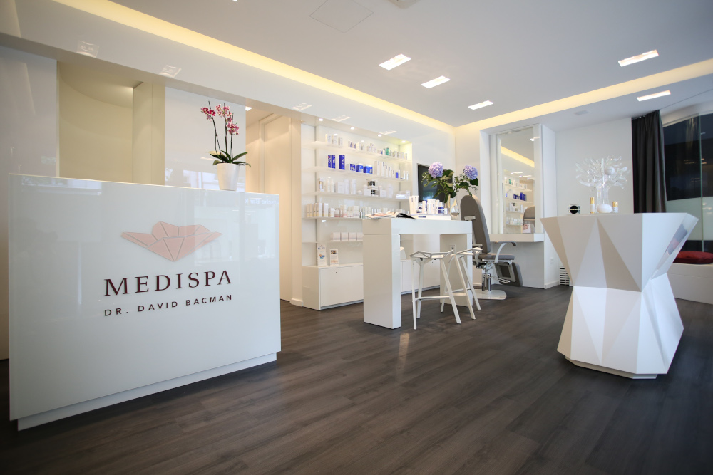 Modern MediSpa reception with sleek treatment tables and luxury spa equipment.