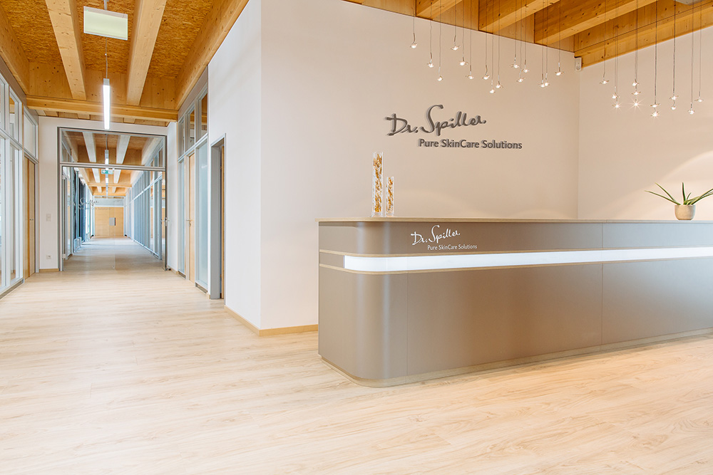 Modern spa reception with wooden accents and elegant lighting at Gharieni.