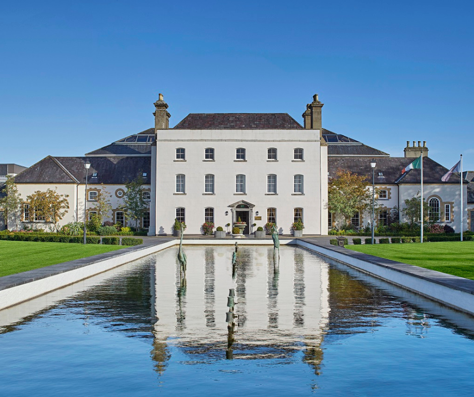 Luxurious spa resort exterior with reflective water feature and elegant architecture.
